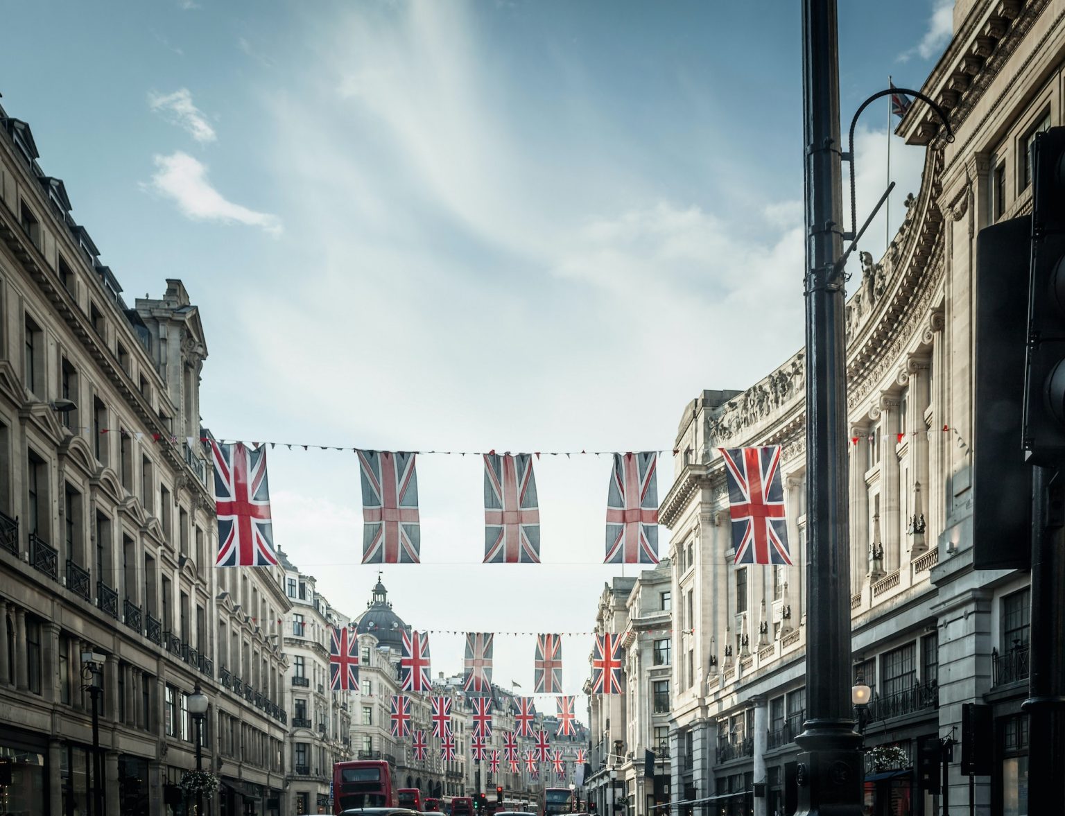 British flags hanging over city street