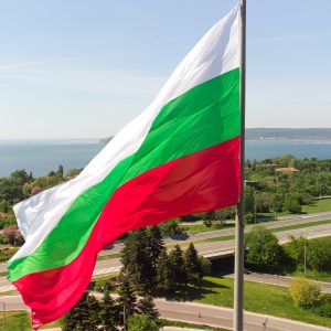 Bulgaria Flag Against City Varna at summer day