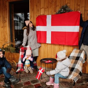 Family with Denmark flags