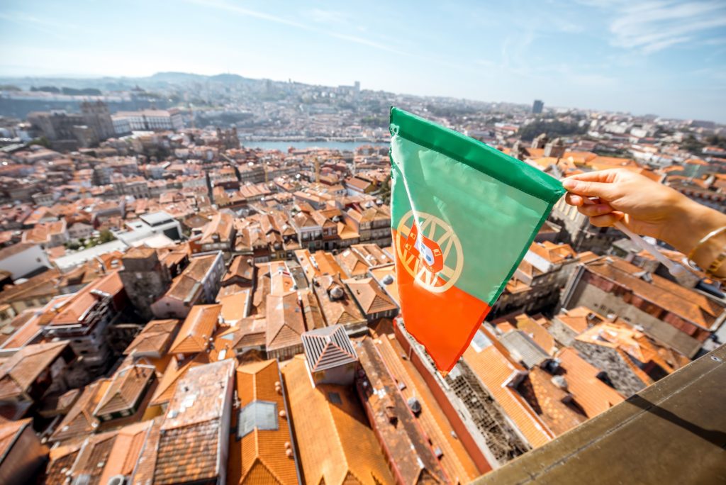 Portuguese flag on the Porto city background