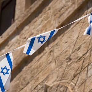 The flag of Israel blowing in the wind. Star of David