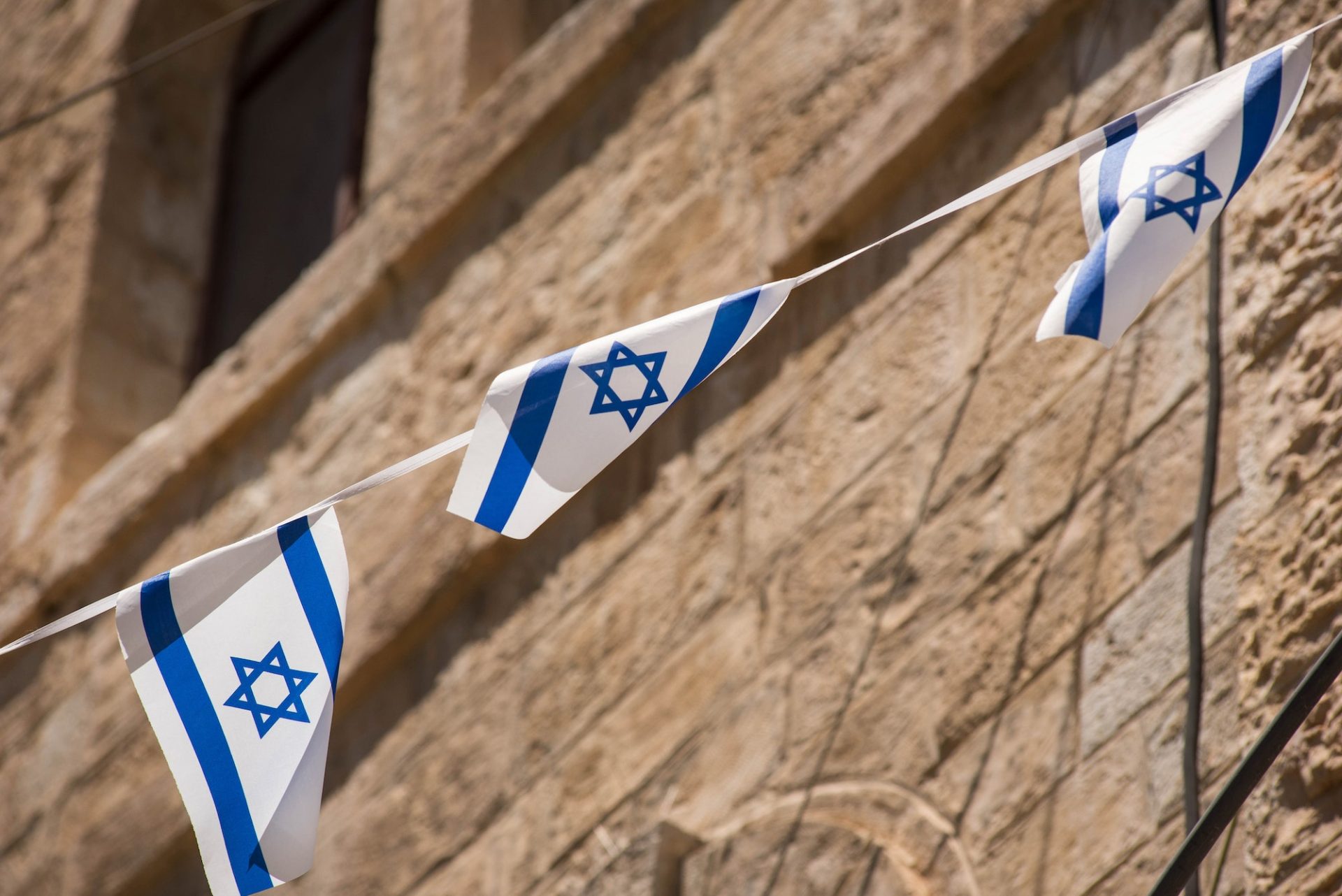 The flag of Israel blowing in the wind. Star of David