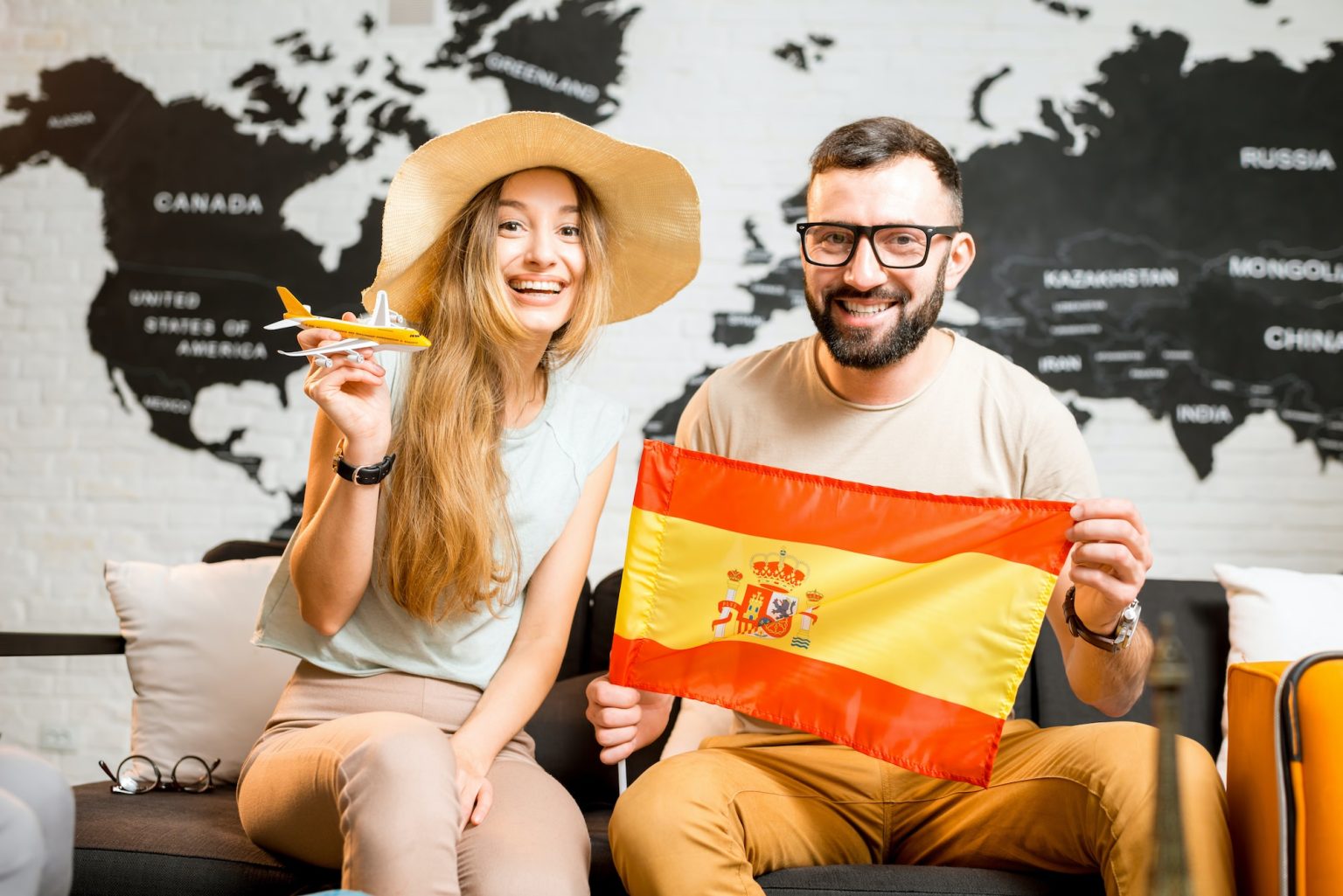 Young couple dreaming about a trip to Spain