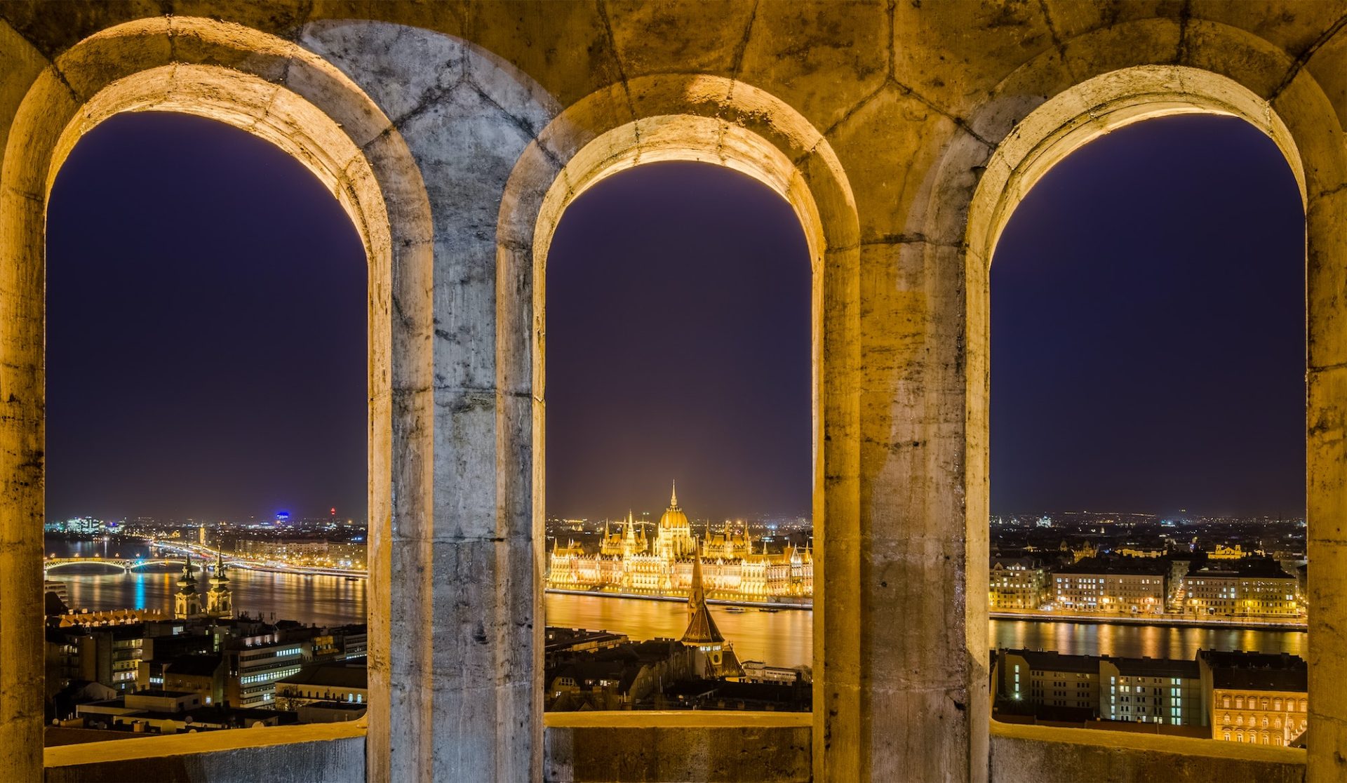 Night view of the Hungarian Parliament Building in Budapest, Hungary.
