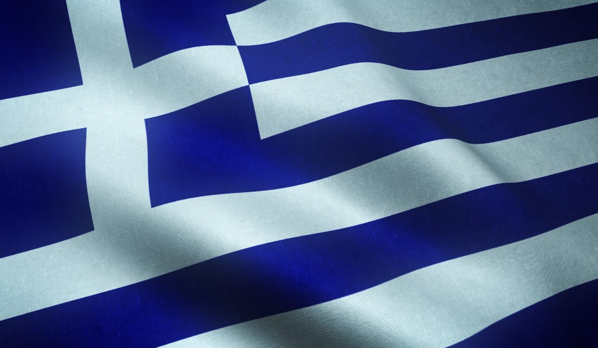 Closeup shot of the waving flag of Greece with interesting textures