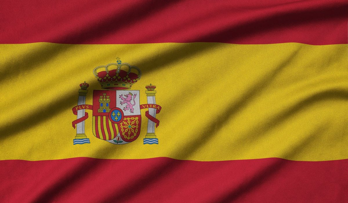 Spain flag is depicted on a sports cloth fabric with many folds. Sport team waving banner